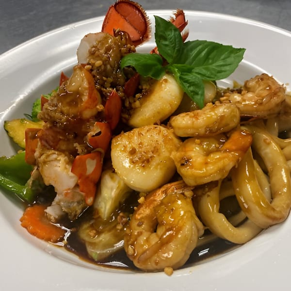 Royal Thai and Sushi's seafood dish with lobster, shrimp, scallops, and squid in a savory sauce.